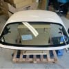 OEM white Miata hardtop.